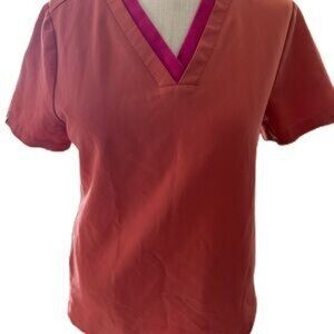 FIGS Technical Collection Women’s Scrub Top. Rust Orange With Pink Neck Accent